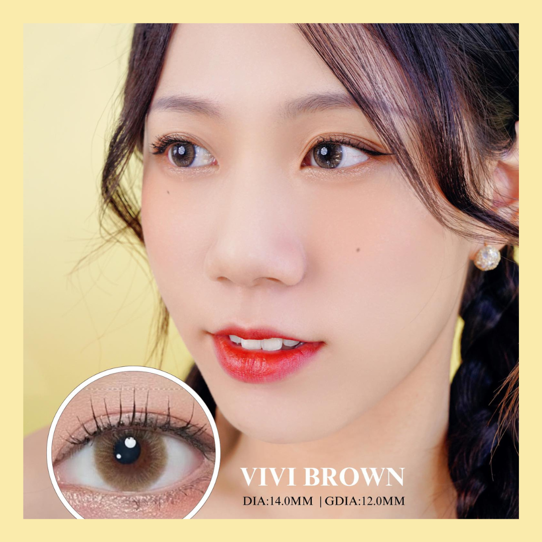 Close-up of a woman's face with brown eyes, wearing red lipstick, and an inset showing brown contact lenses with 'VIVI BROWN' branding.